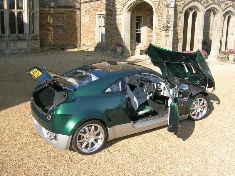 Illustration for article titled The First Modern Hybrid Sports Car Had A Tiny V10 And Never Happened